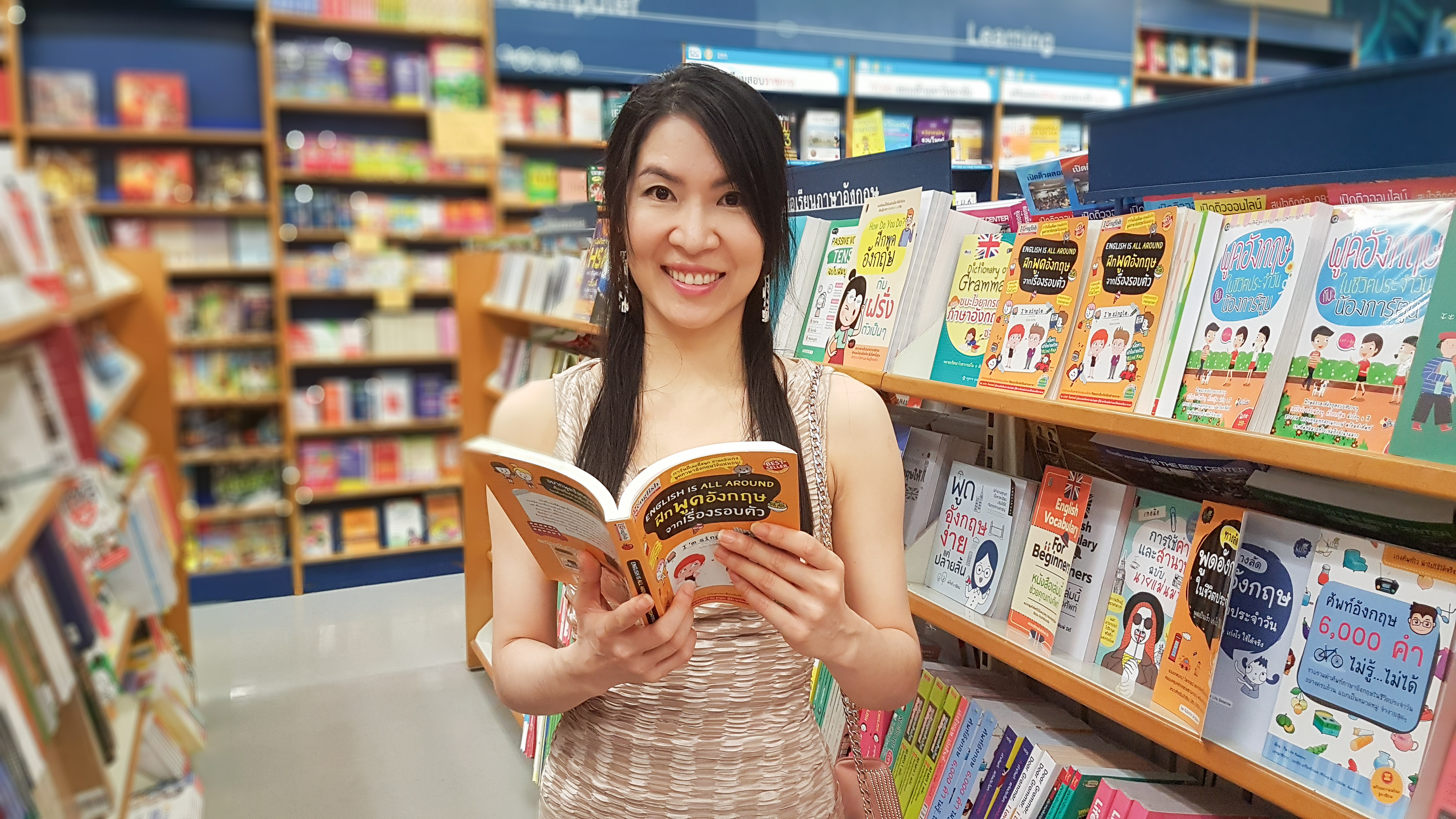 woman reading English language book